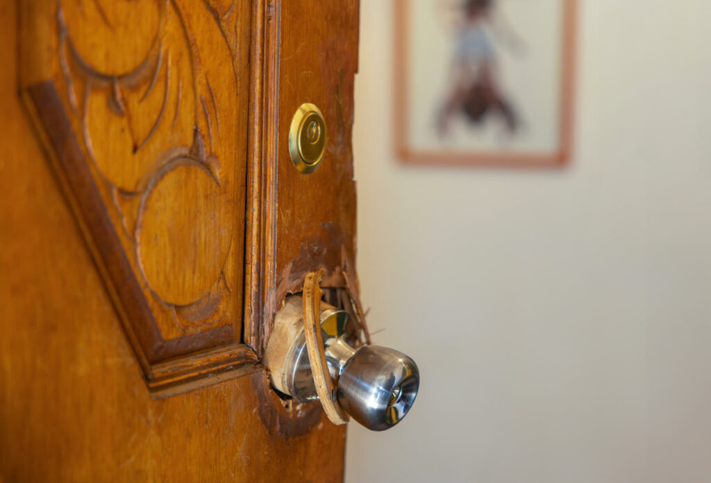 Exterior door damaged by break-in.