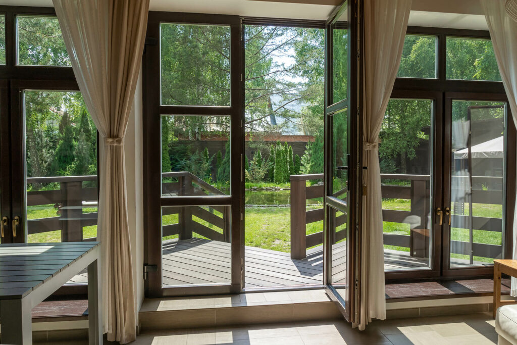 French door with brown sheer curtain.