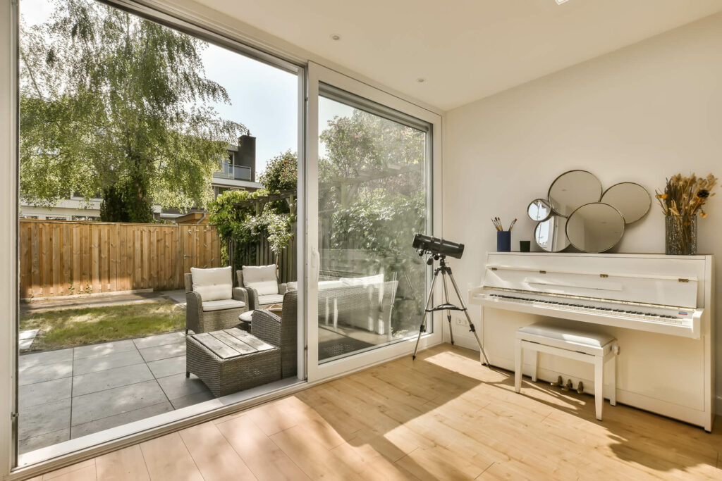 Large PVC sliding patio door leading to a nice backyard.