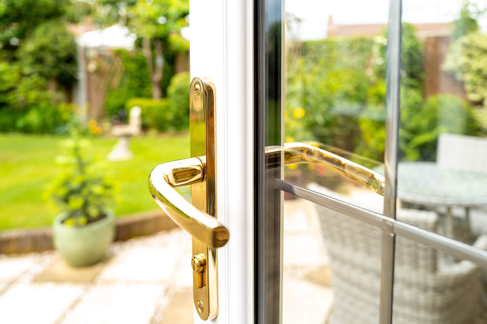 PVC patio door with gold handle.